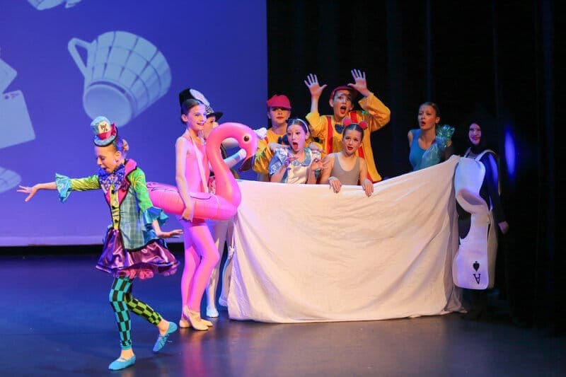 LESTA musical theatre students in an Alice in Wonderland scene
